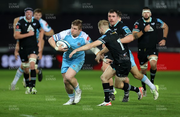 111123 - Ospreys v Glasgow Warriors - United Rugby Championship - Johnny Matthews of Glasgow is tackled by Mat Protheroe of Ospreys 