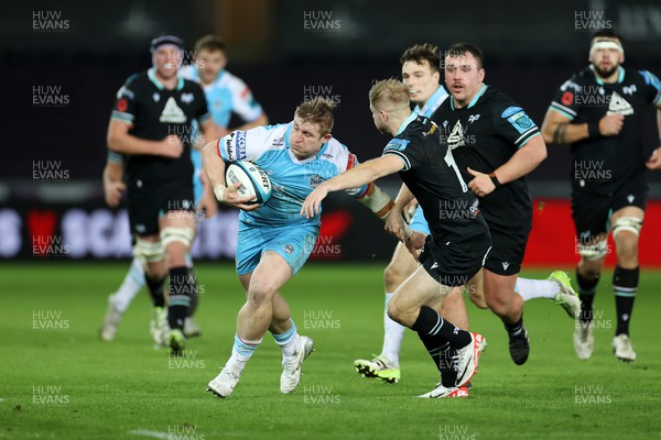 111123 - Ospreys v Glasgow Warriors - United Rugby Championship - Johnny Matthews of Glasgow is tackled by Mat Protheroe of Ospreys 