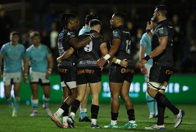 181025 - Ospreys v Glasgow Warriors - United Rugby Championship - Reuben Morgan-Williams of Ospreys celebrates scoring a try with team mates