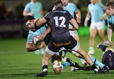 181025 - Ospreys v Glasgow Warriors, United Rugby Championship - Alex Samuel of Glasgow Warriors is tackled by Tom Florence of Ospreys