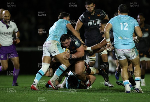 181025 - Ospreys v Glasgow Warriors - United Rugby Championship - Ben Warren of Ospreys is tackled by Adam Hastings of Glasgow 