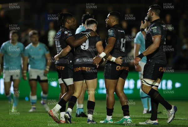 181025 - Ospreys v Glasgow Warriors - United Rugby Championship - Reuben Morgan-Williams of Ospreys celebrates scoring a try with team mates