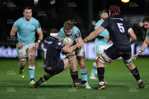 181025 - Ospreys v Glasgow Warriors - United Rugby Championship - Angus Fraser of Glasgow is tackled by Morgan Morse of Ospreys 