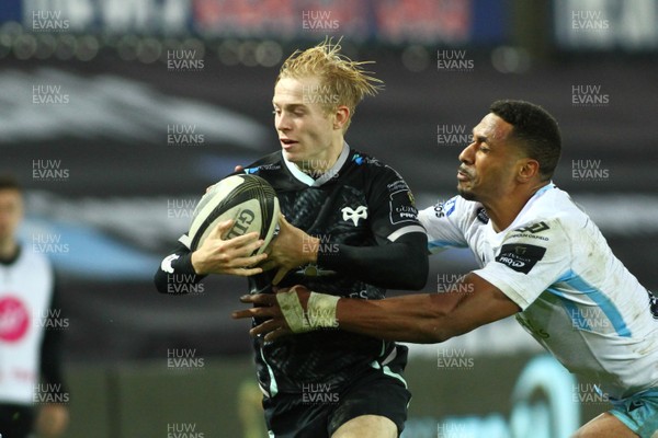 241020 - Ospreys v Glasgow - Guinness PRO14 - Mat Protheroe of Ospreys is tackled by Ratu Tagive of Glasgow Warriors