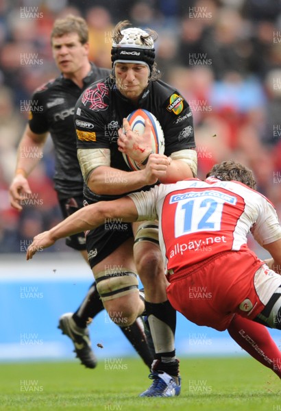 28.03.09 - Gloucester v Ospreys - EDF Energy Cup Semi Final 2009 - Ospreys Ryan Jones is tackled by Gloucester's Anthony Allen. 