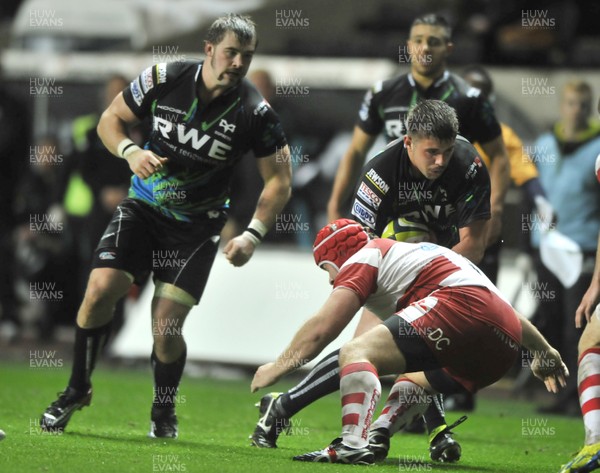 091112 - Ospreys v Gloucester Rugby  -  LV= Cup 2012/2013 -  Ospreys' Ross Jones, rear, is tackled by Glouceter's  Peter Buxton    