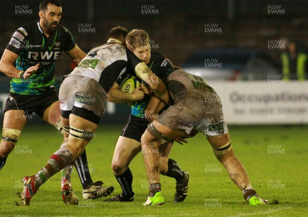 030213 Ospreys v Harlequins - LV=Cup -Ospreys' Jonathan Spratt is tackled by Harlequins Sam Twomey(L) and Joe Trayfoot