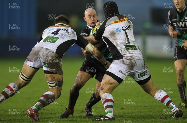 030213 - Ospreys v Harlequins, LV= Cup - Ospreys Jamie Murphy takes on Harlequins' Sam Twomey and  Mark Lambert