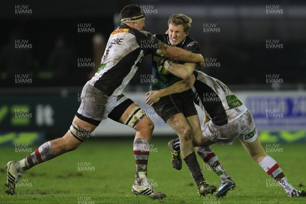 030213 - Ospreys v Harlequins, LV= Cup - Ospreys Ben John is tackled by Harlequins' Charlie Matthews and Harlequins' Sam Smith