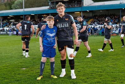 180426 - Ospreys v Hollywoodbets Sharks - United Rugby Championship - Jac Morgan of Ospreys with mascot before the match