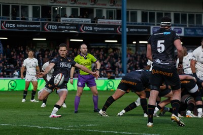 180426 - Ospreys v Hollywoodbets Sharks - United Rugby Championship - Kieran Hardy of Ospreys kicks the ball