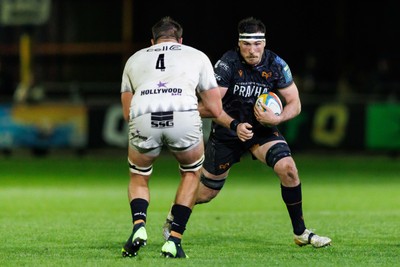 180426 - Ospreys v Hollywoodbets Sharks - United Rugby Championship - Ryan Smith of Ospreys takes on Jason Jenkins of Sharks