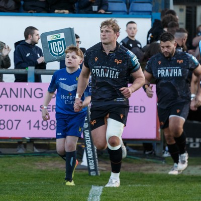180426 - Ospreys v Hollywoodbets Sharks - United Rugby Championship - Jac Morgan of Ospreys and mascot lead the Ospreys team out onto the pitch