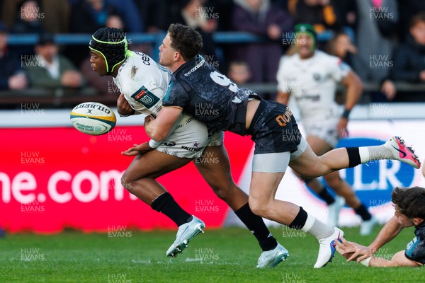 180426 - Ospreys v Hollywoodbets Sharks - United Rugby Championship - Zekhethelo Siyaya of Sharks is tackled by Kieran Hardy of Ospreys
