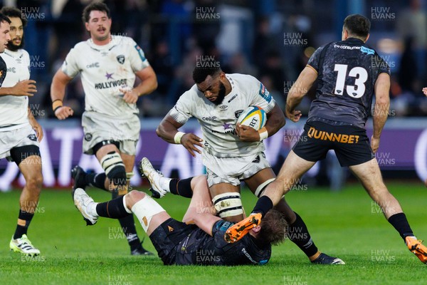 180426 - Ospreys v Hollywoodbets Sharks - United Rugby Championship - Vincent Tshituka of Sharks is tackled by Jac Morgan of Ospreys