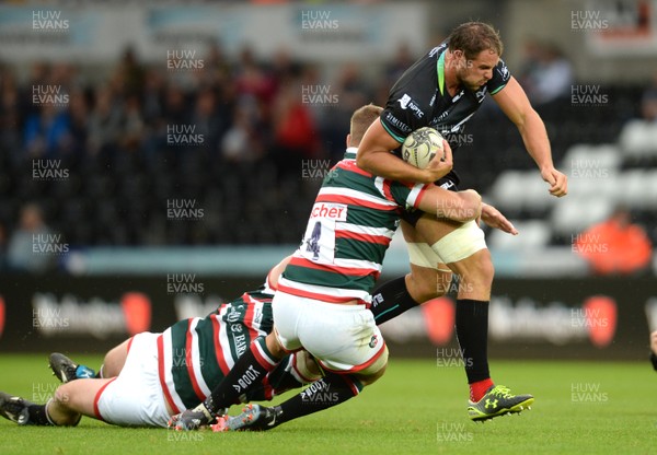 120816 - Ospreys v Leicester - Preseason Friendly -Tyler Ardron of Ospreys is tackled by Ed Salter of Leicester