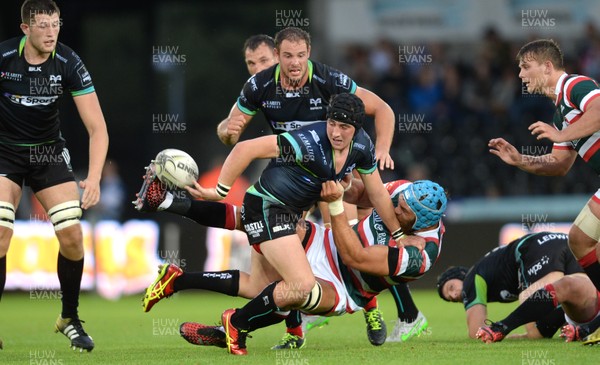 120816 - Ospreys v Leicester - Preseason Friendly -Sam Davies of Ospreys is tackled by Ed Salter of Leicester