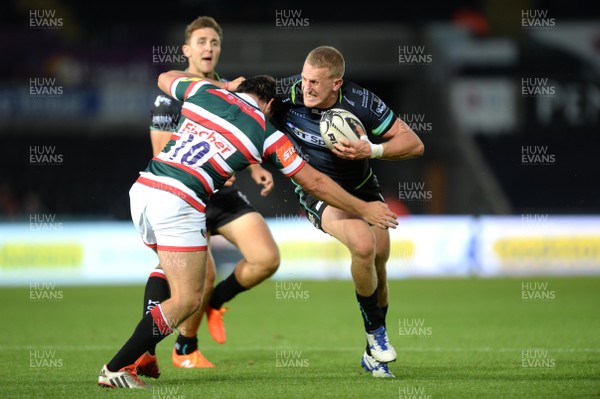 120816 - Ospreys v Leicester - Preseason Friendly -Ben John of Ospreys is tackled by Freddie Burns of Leicester