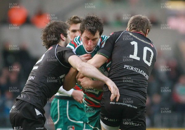 130113 Ospreys v Leicester Tigers - Heineken Cup -Leicester's Louis Deacon is tackled by Osprey's Andrew Bishop(L) and Dan Biggar