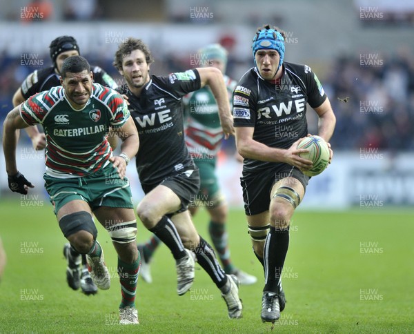 130113 - Ospreys v Leicester - Heineken Cup -    Ospreys'  Justin Tipuric, right, breaks through the Leicester's defence  