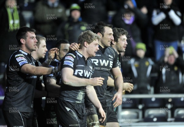 130113 - Ospreys v Leicester - Heineken Cup -    Ospreys' try scorers Jonathan Sprat, front, and Joe Bearman celebrate with team members after scoring a try to level the match  