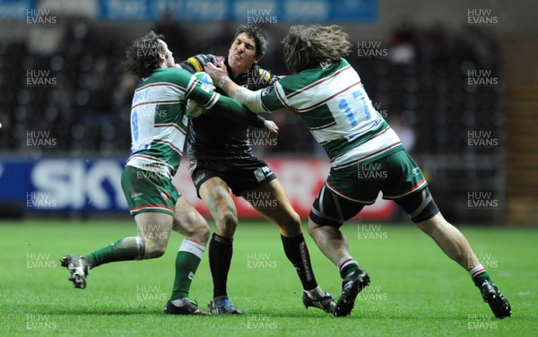 24.01.09 - Ospreys v Leicester - Heineken Cup - Ospreys James Hook is tackled by Leicester's Julien Dupuy and Martin Castrogiovanni. 