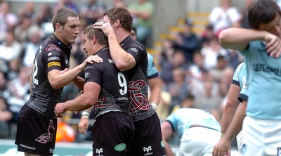 22.08.08 -  Ospreys v Leicester Tigers ... Shane Williams Testimonial match -  Ospreys try scorer Rhys Webb is congratulated by Andrew Bishop and David Bishop.