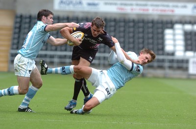 22.08.08 -  Ospreys v Leicester Tigers ... Shane Williams Testimonial match -  Leicester Tigers Dan Hipkiss and Toby Flood combine to bring down Ospreys Lee Byrne. 