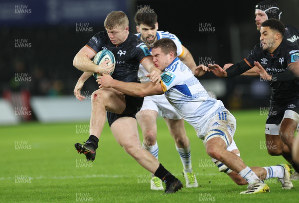 070123 - Ospreys v Leinster,  BKT United Rugby Championship - Keiran Williams of Ospreys attempts to break the tackle from Scott Penny of Leinster