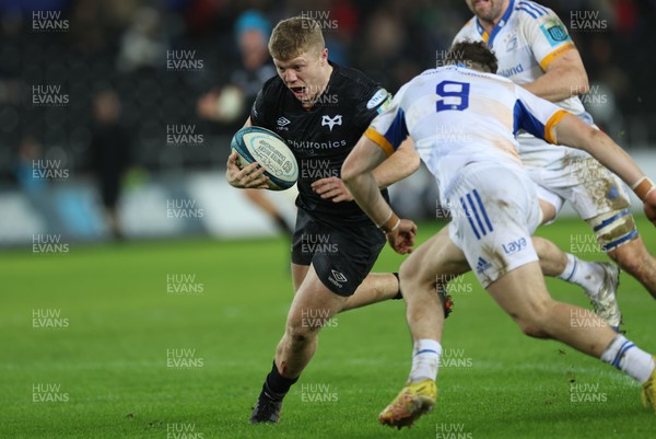 070123 - Ospreys v Leinster,  BKT United Rugby Championship - Keiran Williams of Ospreys takes on Cormac Foley of Leinster