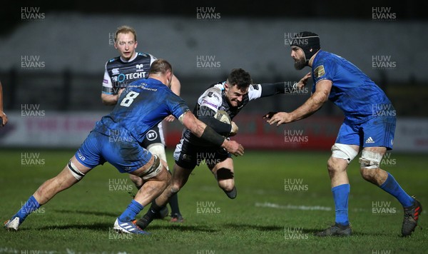 210220 - Ospreys v Leinster - Guinness PRO14 - Luke Morgan of Ospreys is tackled by Rhys Ruddock and Scott Fardy of Leinster