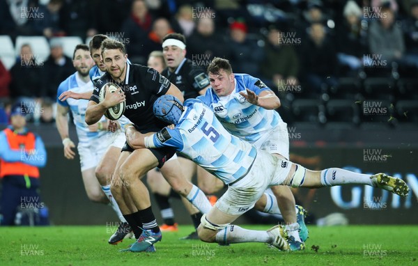 240318 - Ospreys v Leinster, Guinness PRO14 - Ashley Beck of Ospreys looks for support as he is tackled by Scott Fardy of Leinster