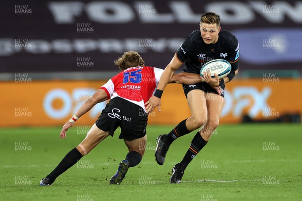 240922 - Ospreys v Lions - United Rugby Championship - Max Nagy of Ospreys is tackled by Andries Coetzee of Lions