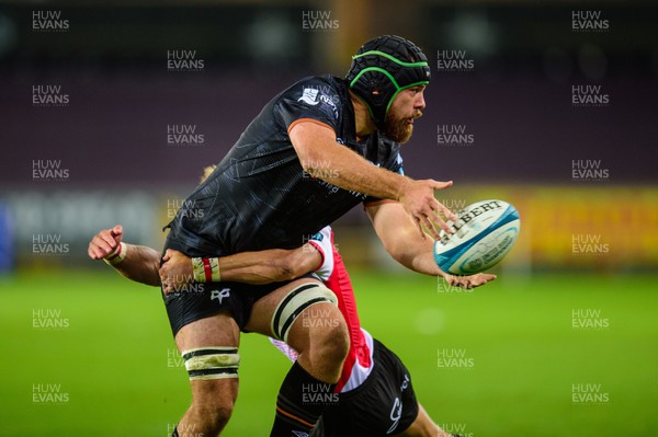 240922 - Ospreys v Emirates Lions - United Rugby Championship - Morgan Morris of Ospreys is tackled by Andries Coetzee of Lions