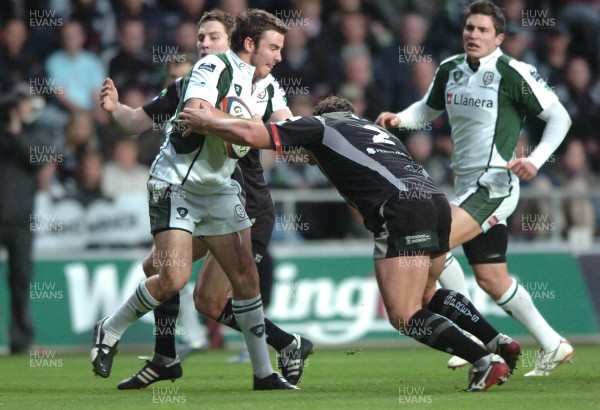 04.11.07 - Ospreys v London Irish - EDF Energy Cup - London Irish Tim Curran is tackled by Huw Bennett(R) and Andrew Bishop 