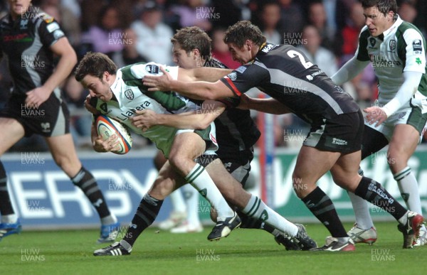 04.11.07 - Ospreys v London Irish - EDF Energy Cup - London Irish Tim Curran is tackled by Huw Bennett(R) and Andrew Bishop 