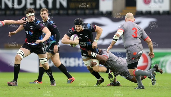 150117 - Ospreys v Lyon - European Rugby Challenge Cup - James King of Ospreys is tackled by Sami Mavinga of Lyon by Chris Fairweather/Huw Evans Agency