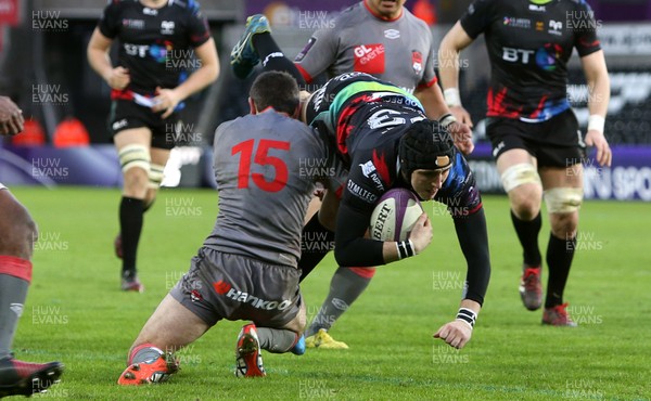 150117 - Ospreys v Lyon - European Rugby Challenge Cup - Sam Davies of Ospreys is tackled by Romain Loursac of Lyon by Chris Fairweather/Huw Evans Agency