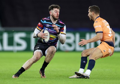 140123 - Ospreys v Montpellier - European Rugby Champions Cup - Alex Cuthbert of Ospreys is tackled by Vincent Rattez of Montpellier