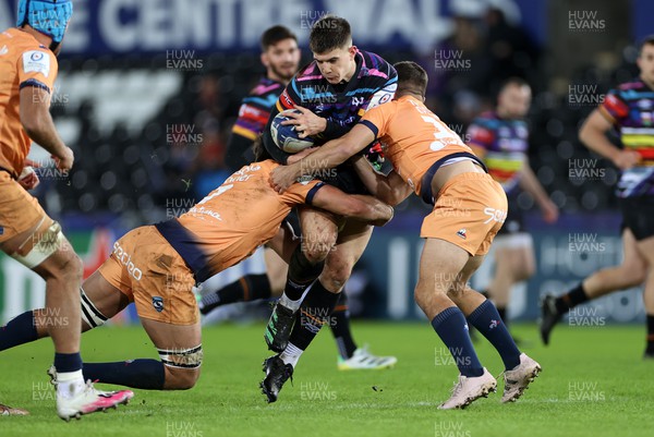 140123 - Ospreys v Montpellier - European Rugby Champions Cup - Joe Hawkins of Ospreys is tackled by Alexandre Becognee and Louis Carbonel of Montpellier