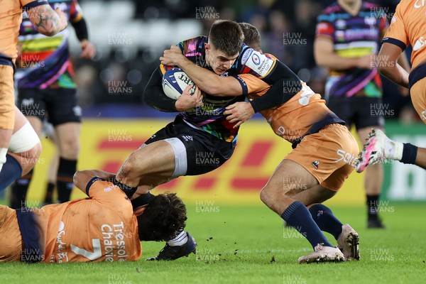 140123 - Ospreys v Montpellier - European Rugby Champions Cup - Joe Hawkins of Ospreys is tackled by Alexandre Becognee and Louis Carbonel of Montpellier