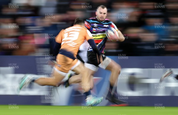 140123 - Ospreys v Montpellier - European Rugby Champions Cup - Cai Evans of Ospreys is challenged by �Thomas Darmon of Montpellier 