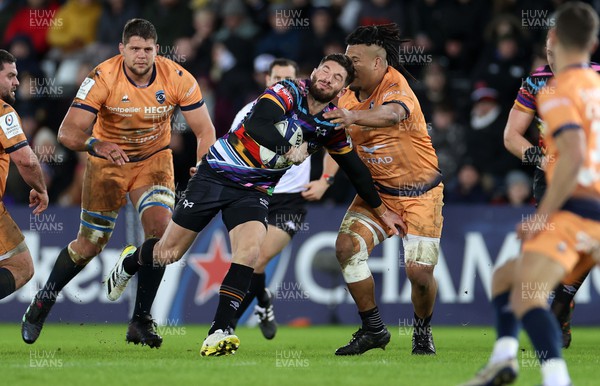 140123 - Ospreys v Montpellier - European Rugby Champions Cup - Owen Williams of Ospreys is tackled by Brandon Paenga-Amosa of Montpellier
