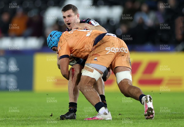 140123 - Ospreys v Montpellier - European Rugby Champions Cup - Michael Collins of Ospreys is tackled by Zach Mercer of Montpellier 