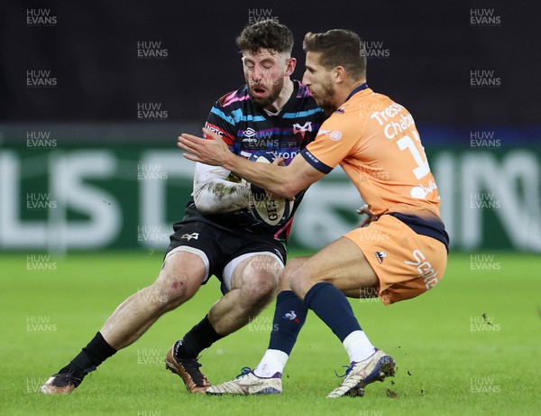 140123 - Ospreys v Montpellier - European Rugby Champions Cup - Alex Cuthbert of Ospreys is tackled by Vincent Rattez of Montpellier