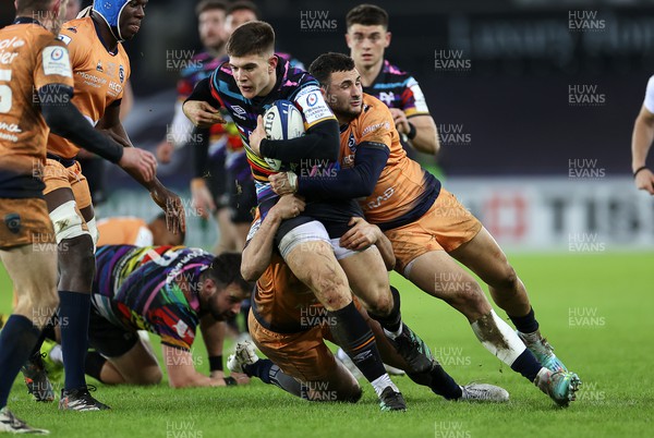 140123 - Ospreys v Montpellier - European Rugby Champions Cup - Joe Hawkins of Ospreys is tackled by Geoffrey Doumayrou and Thomas Darmon of Montpellier 