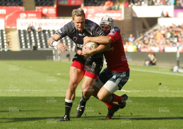 070315 - Ospreys v Munster - GuinnessPro12 -Hanno Dirksen of Ospreys is tackled by Duncan Williams of Munster