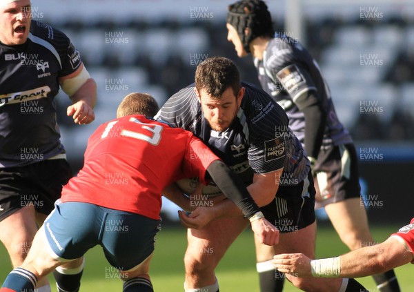 070315 - Ospreys v Munster - GuinnessPro12 -Ryan Bevington of takes on Keith Earls of Munster