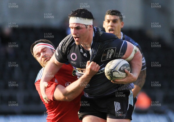 070315 - Ospreys v Munster - GuinnessPro12 -Ryan Bevington of Ospreys is tackled by Billy Holland of Munster 