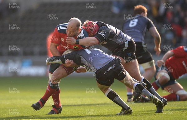 070315 - Ospreys v Munster - Guinness PRO12 -BJ Botha of Munster is tackled by Sam Davies and Scott Otten of Ospreys